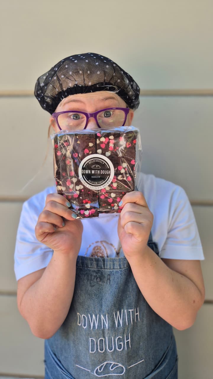 Down With Dough baker holding brownies